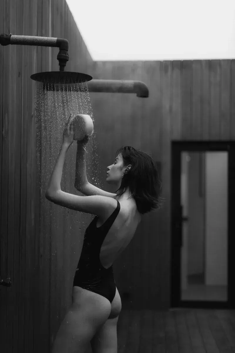 Monochrome Photo of an Alluring Woman taking a Shower